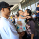 An OFW working in Qatar says goodbye to her family before boarding a flight in Manila, January 12, 2015.